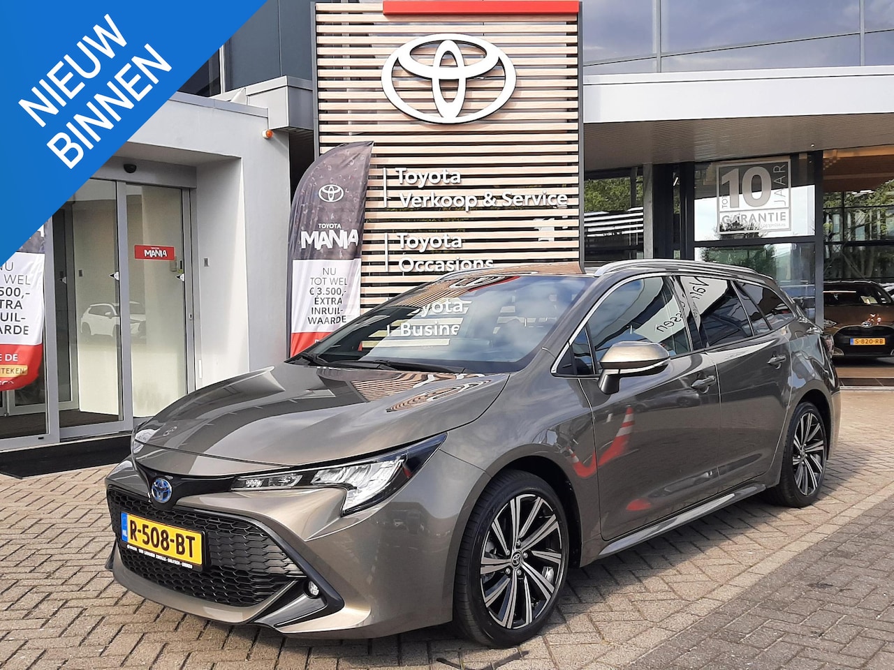 Toyota Corolla Touring Sports - 1.8 Hybrid Dynamic TREKHAAK NAVI STOELVERW APPLE/ANDROID AD-CRUISE HALF-LEDER LMV DAB+ - AutoWereld.nl