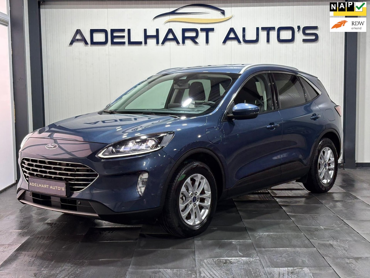 Ford Kuga - 2.5 PHEV Titanium automaat / HUD / Navigatie full map / Camera / Cruise control / Climate - AutoWereld.nl