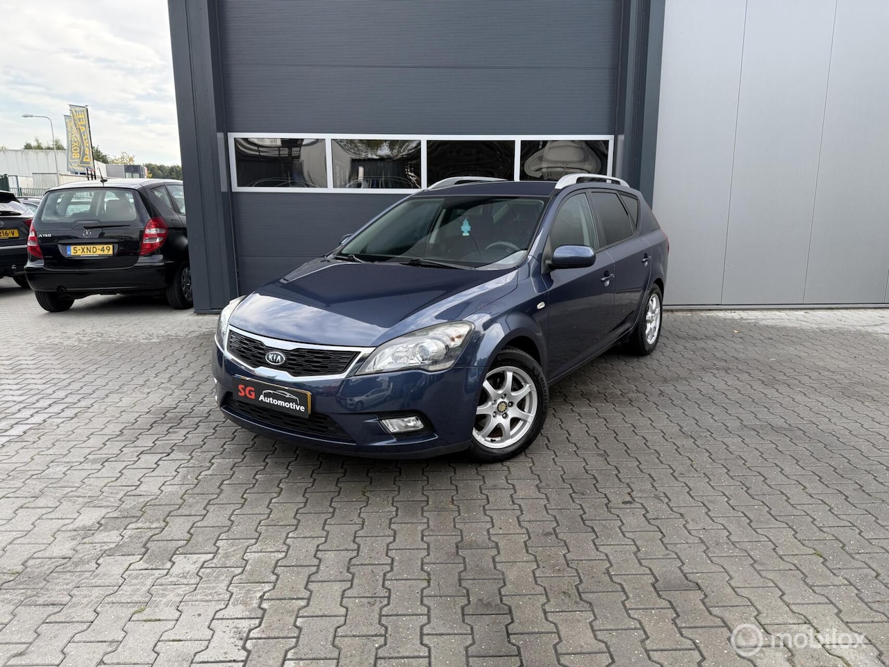 Kia Cee'd Sporty Wagon - 1.4 CVVT X-ecutive Handel / Export - AutoWereld.nl
