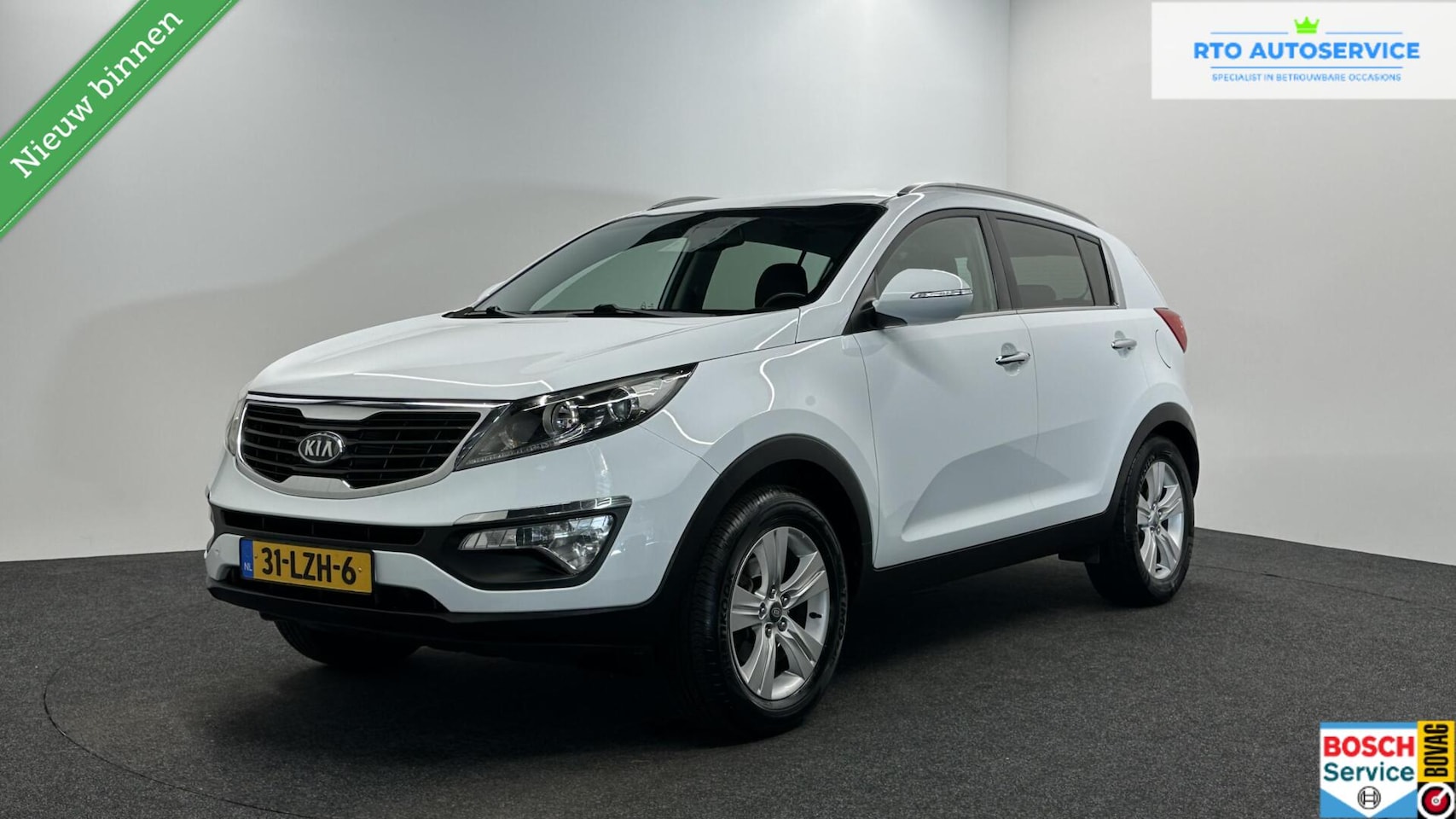 Kia Sportage - 2.0 X-ecutive Plus Pack CRUISE ECC TREKHAAK. - AutoWereld.nl