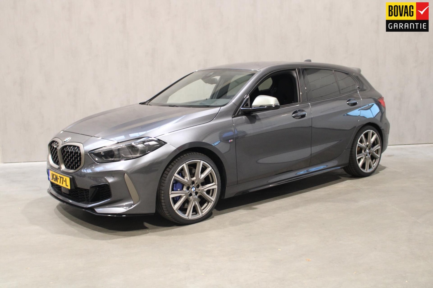 BMW 1-serie - M135i xDrive High Executive 1e eigenaar Harman Kardon Bucket Seat - AutoWereld.nl