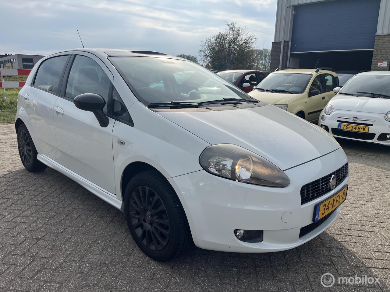 Fiat Grande Punto - 1.4 NeroBianco panorama - AutoWereld.nl
