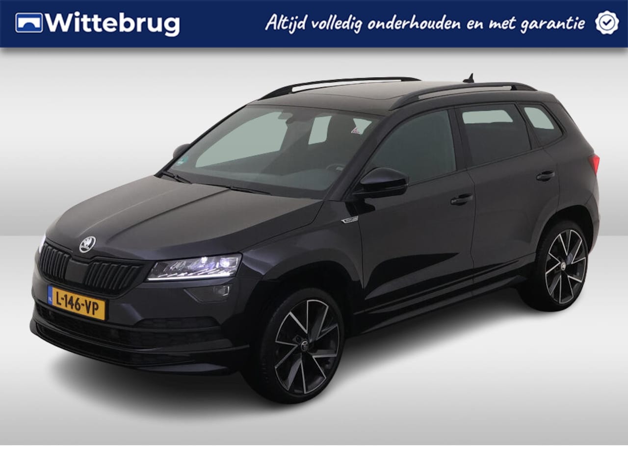 Skoda Karoq - 1.5 TSI ACT Sportline Business / Panorama dak / Alcantara- Leder / Sfeerverlichting / Stoe - AutoWereld.nl