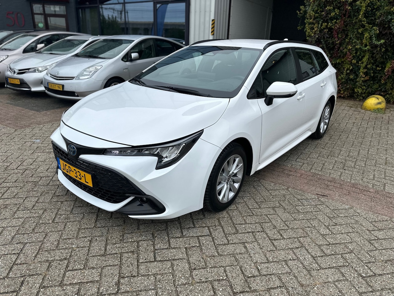 Toyota Corolla Touring Sports - Hybrid 140 Business - AutoWereld.nl