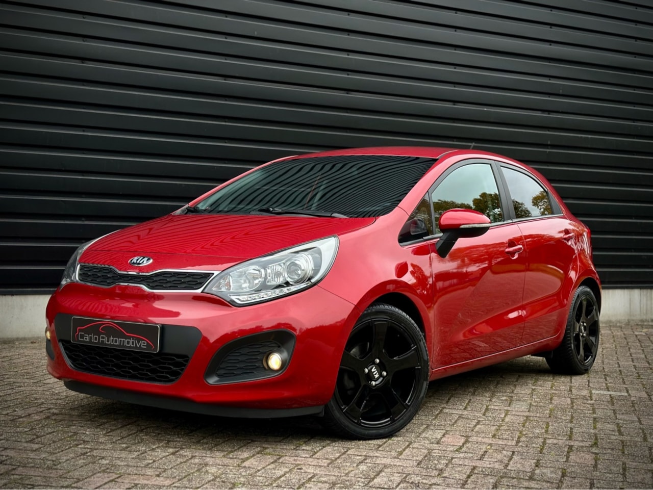 Kia Rio - 1.2 CVVT 5-DEURS LEDER|AIRCO|CRUISE|PDC|LED - AutoWereld.nl