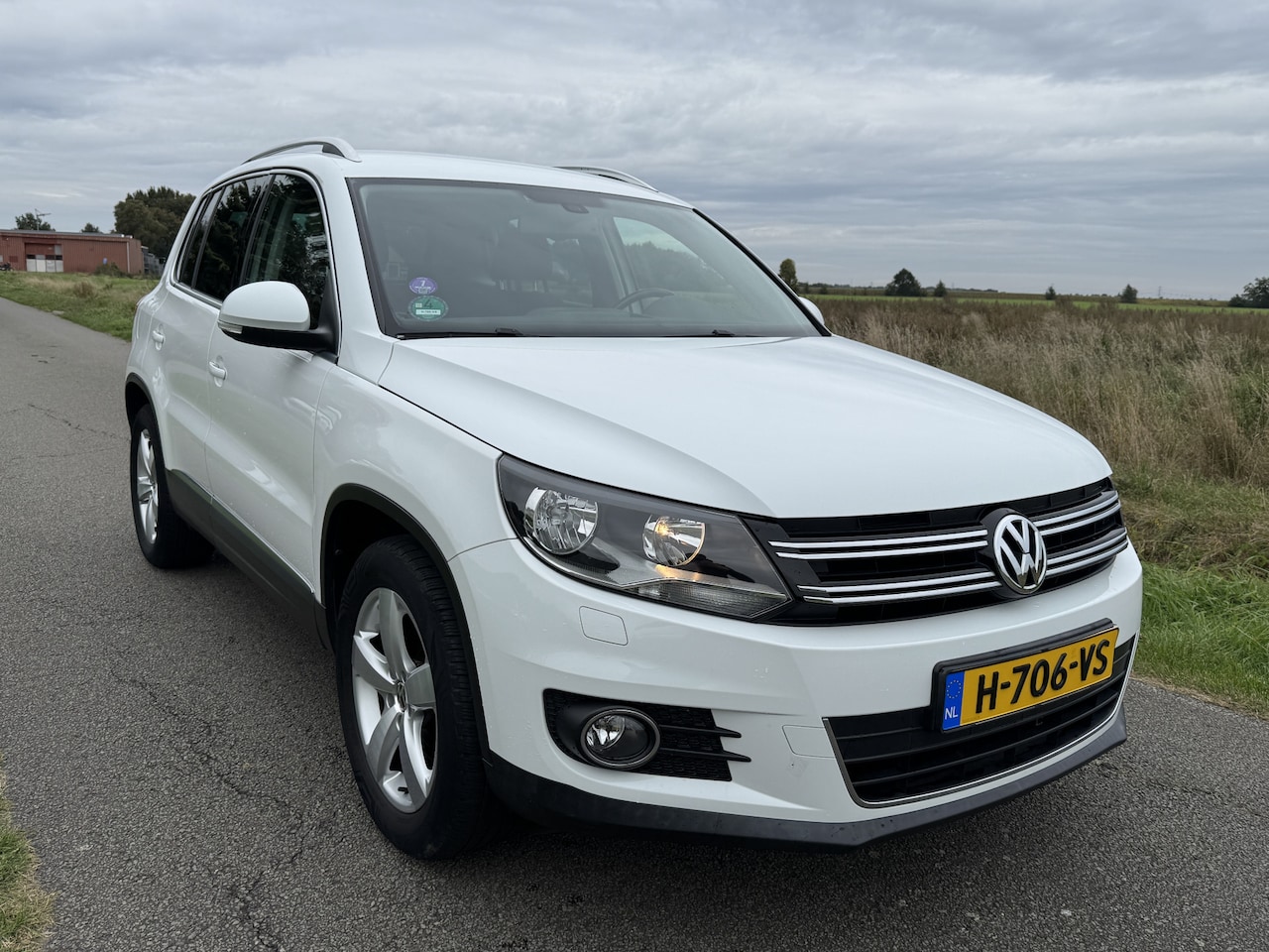 Volkswagen Tiguan - 1.4 TSI Sport&Style NAVI/ECC/CRUISE/STOELVERW - AutoWereld.nl