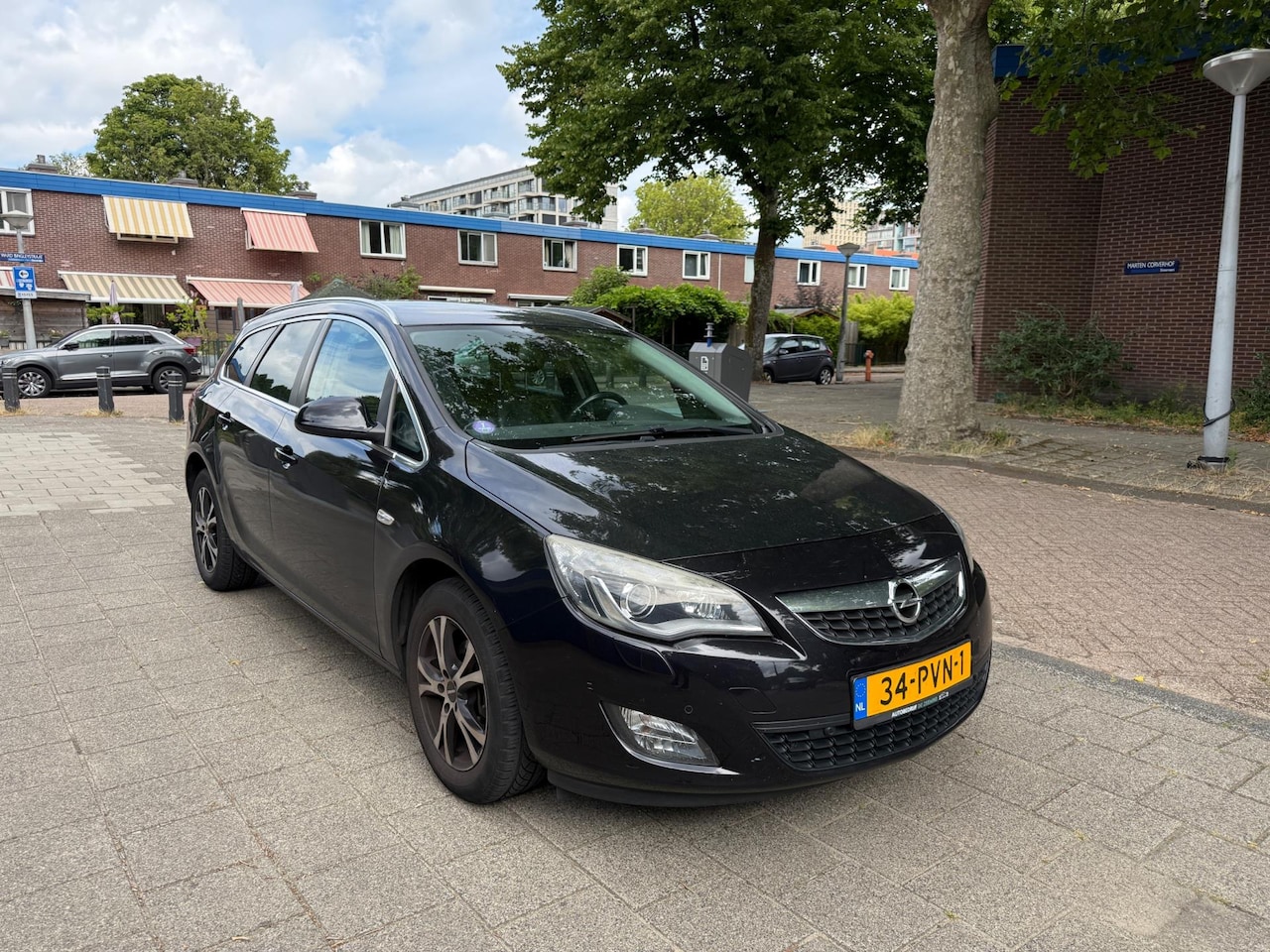 Opel Astra Sports Tourer - 1.4 Cosmo Leder Cruise Airco - AutoWereld.nl