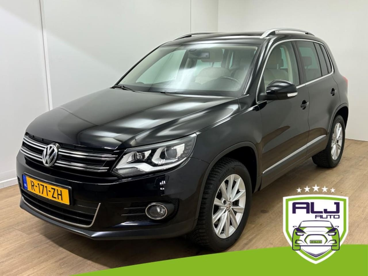 Volkswagen Tiguan - Occasion 2.0 TSI Sport&Style 4Motion | Tweedehands Volkswagen Tiguan | Zwart | Stoelverwar - AutoWereld.nl
