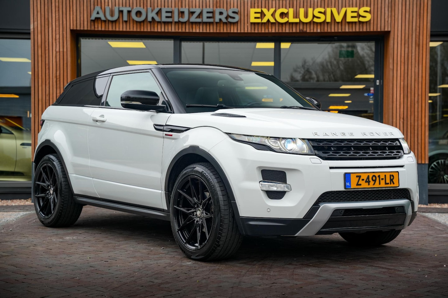 Land Rover Range Rover Evoque Coupé - 2.0 Si 4WD Prestige Panodak Camera Keyless Meridian Memory Stoel Stuurverw. Clima Cruise T - AutoWereld.nl