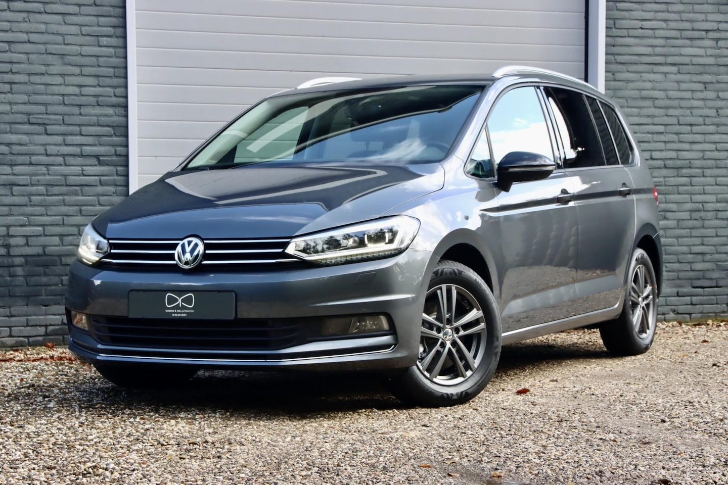 Volkswagen Touran - 1.4 TSI Comfortline Business 7p | PANORAMA | ACC | NAVIGATIE | CARPLAY - AutoWereld.nl