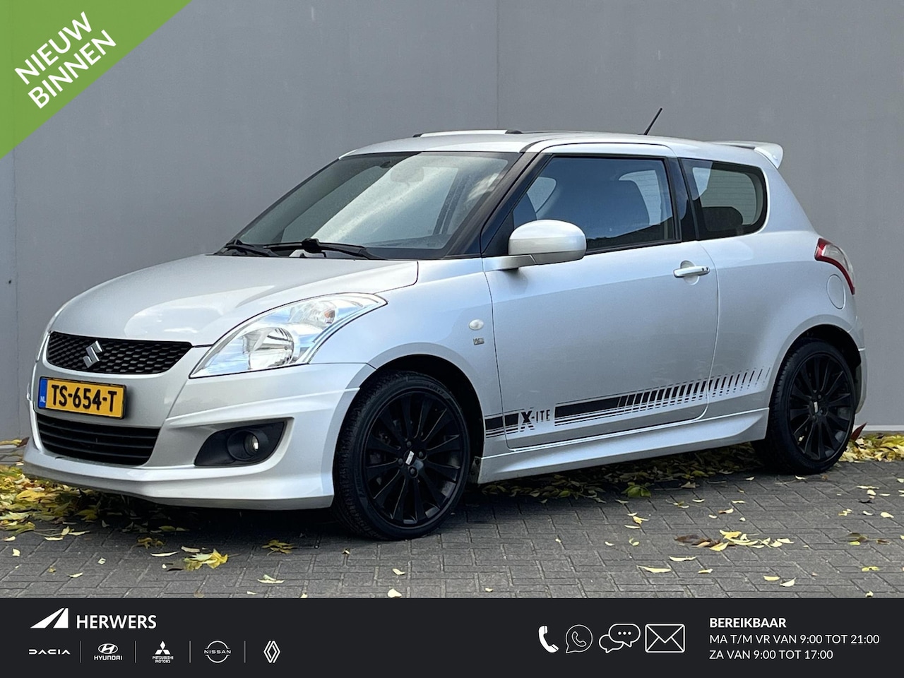 Suzuki Swift - 1.2 Exclusive X-ITE / Trekhaak (Trekgewicht 1.000kg) / Elektrisch Glazen Schuif- en Kantel - AutoWereld.nl