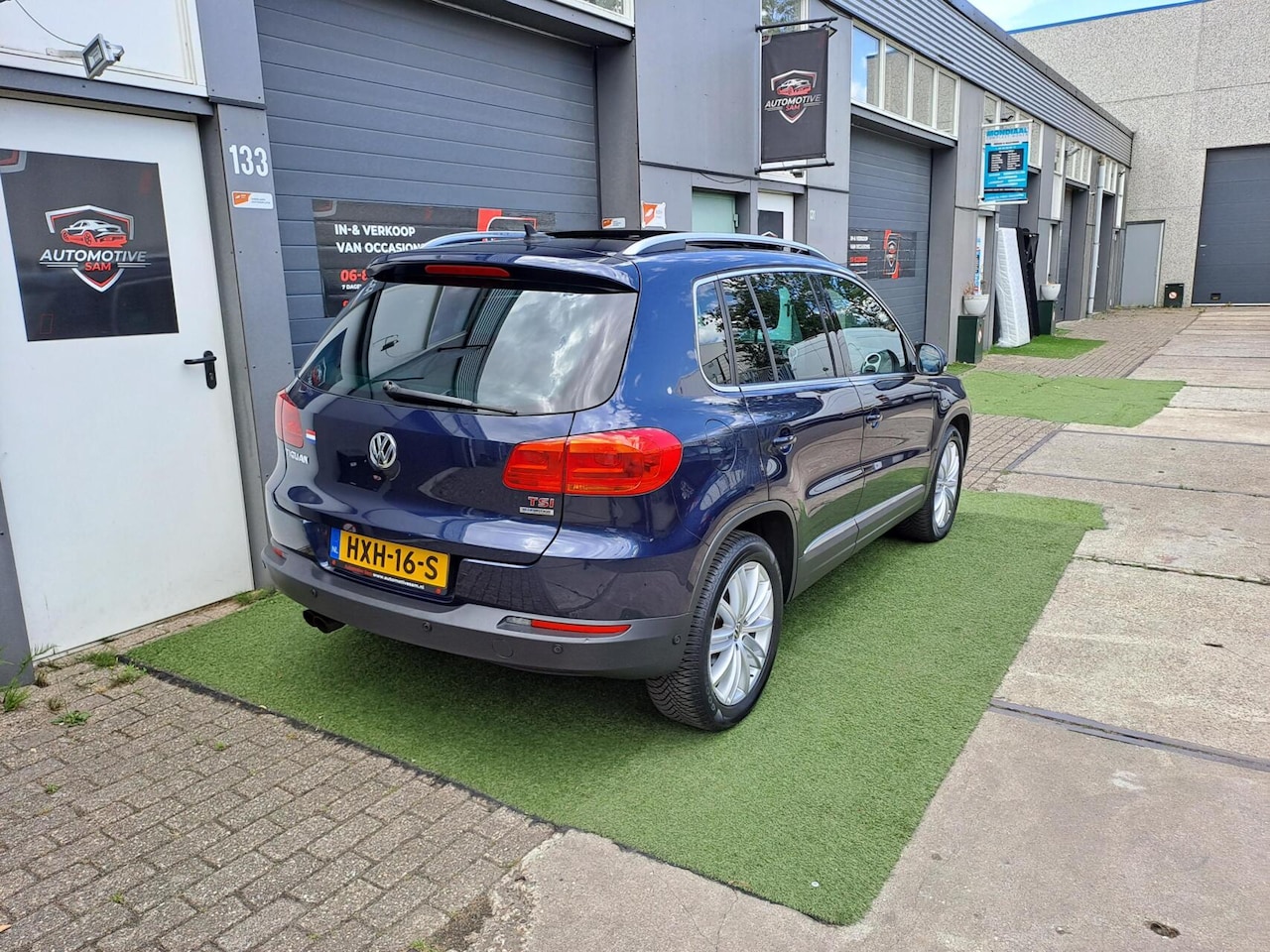 Volkswagen Tiguan - 1.4 TSI Sport&Style Pano Cruise Clima PDC - AutoWereld.nl