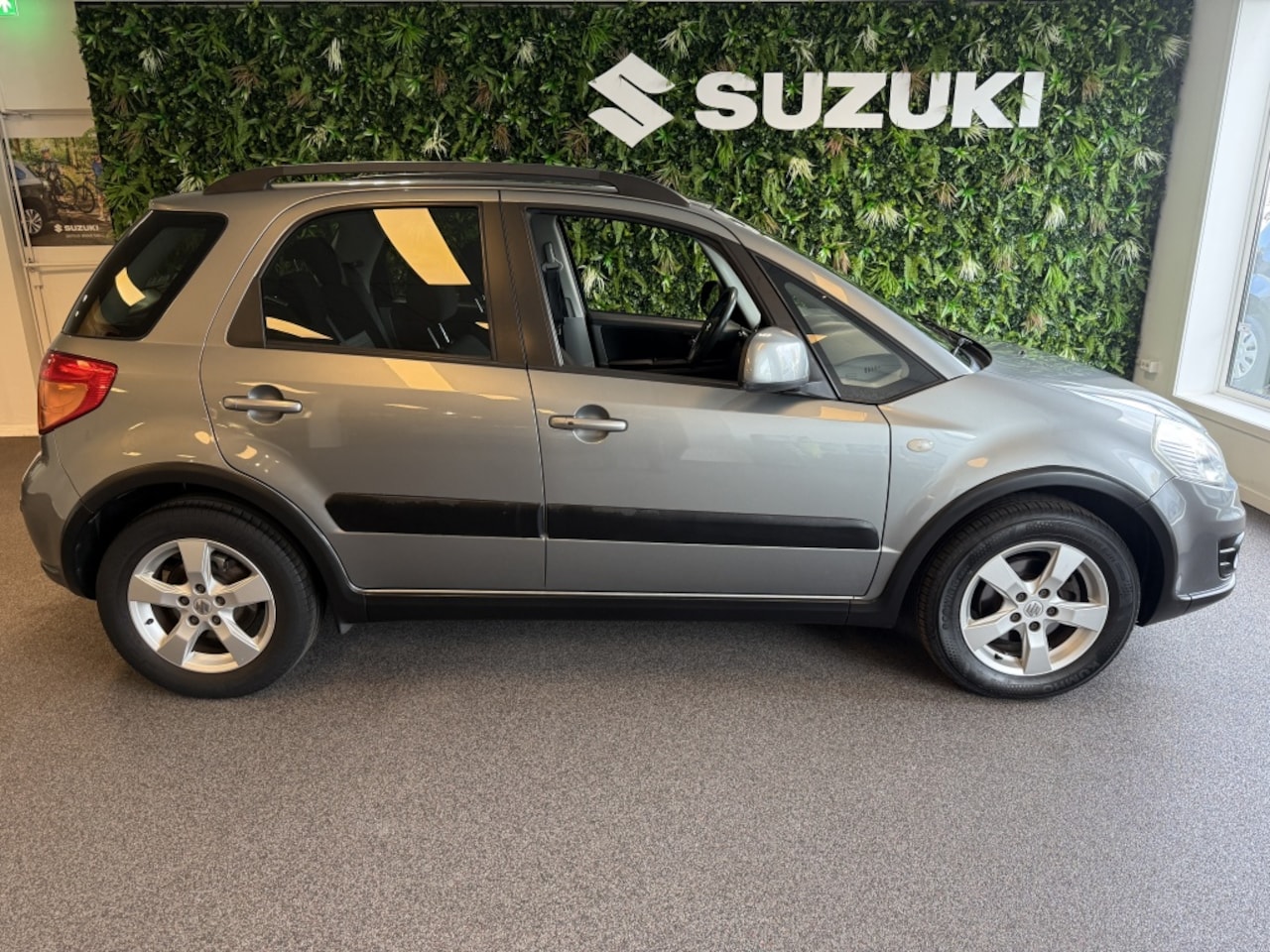 Suzuki SX4 - Clima LMV Trekhaak 1.6 Exclusive Parkeersensoren Stootlijsten Audio met stuurbed. - AutoWereld.nl