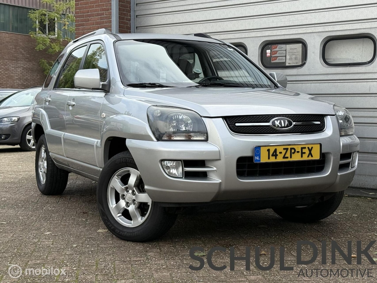 Kia Sportage - 2.0 CVVT X-ecutive CRUISE CONTROLE|AIRCO|TREKHAAK - AutoWereld.nl