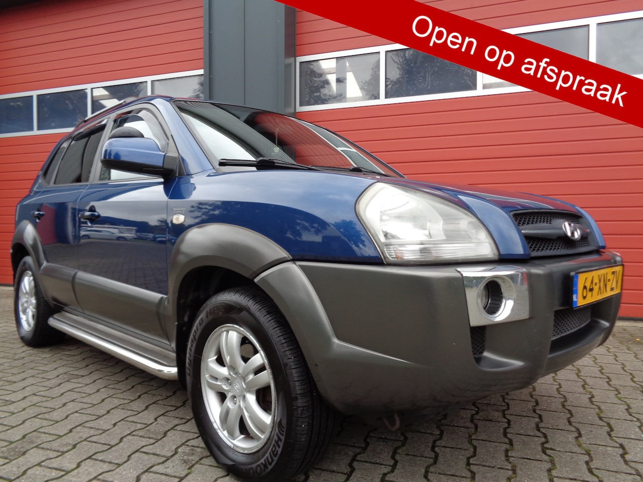 Hyundai Tucson - 2.0i Style World Cup edition 142PK Clima Cruise Leer Trekhaak NL-Auto LMV - AutoWereld.nl