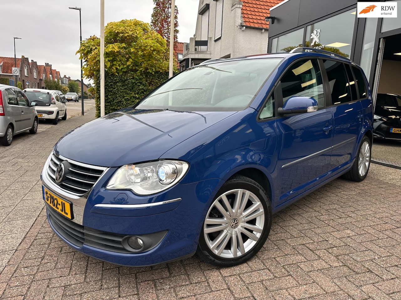 Volkswagen Touran - 1.4 TSI Optive|7 Persoons|Trekhaak|Navi|PDC - AutoWereld.nl