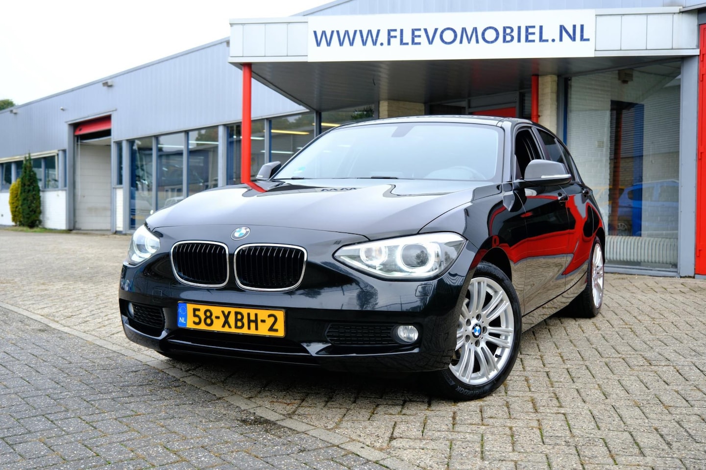 BMW 1-serie - 118d Business+ Aut. Xenon|Navi|Airco|LMV - AutoWereld.nl