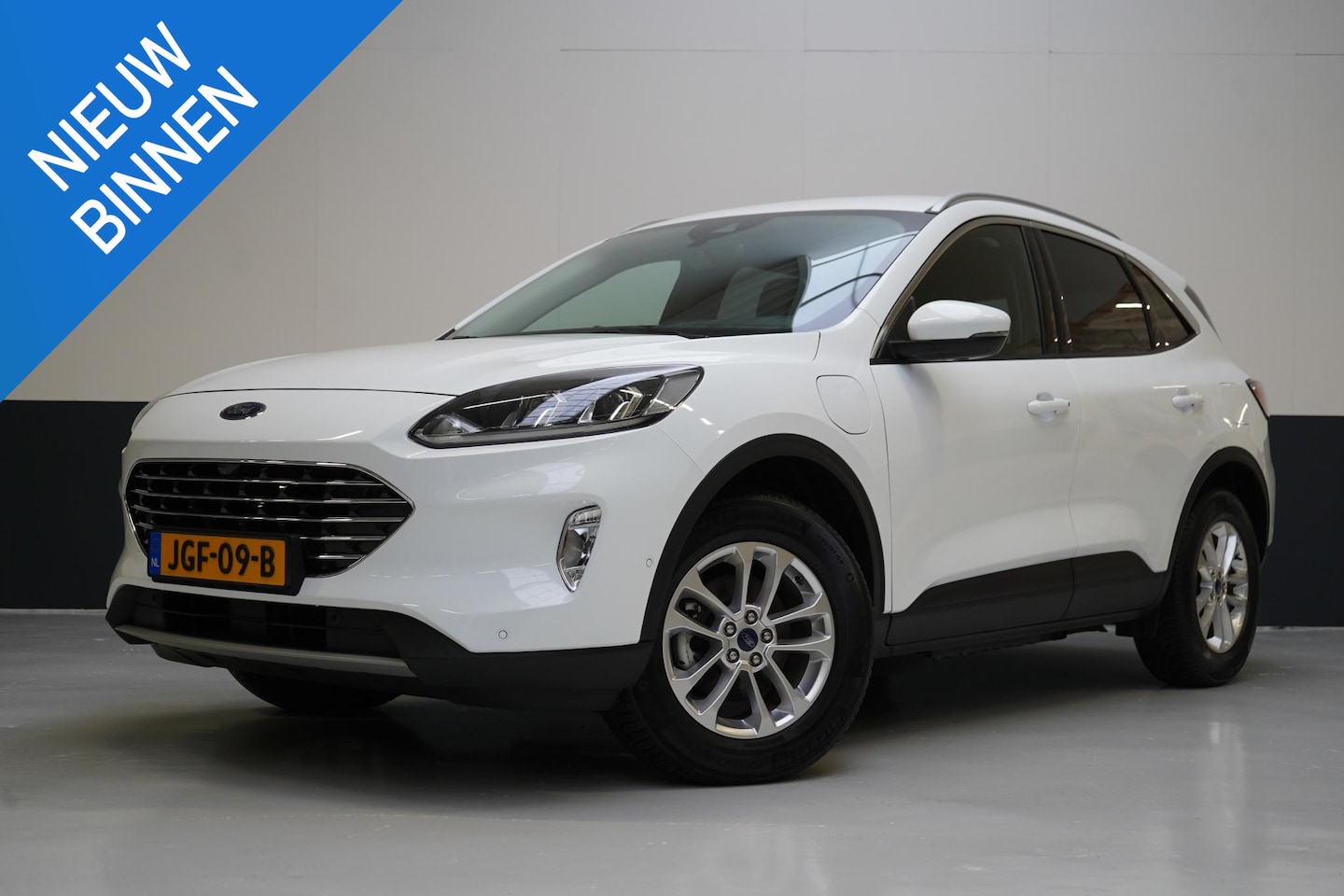 Ford Kuga - 2.5 PHEV Titanium | Adapt. Cruise | Voorruitverwarming | Privacy Glass | Navigatie | Clima - AutoWereld.nl