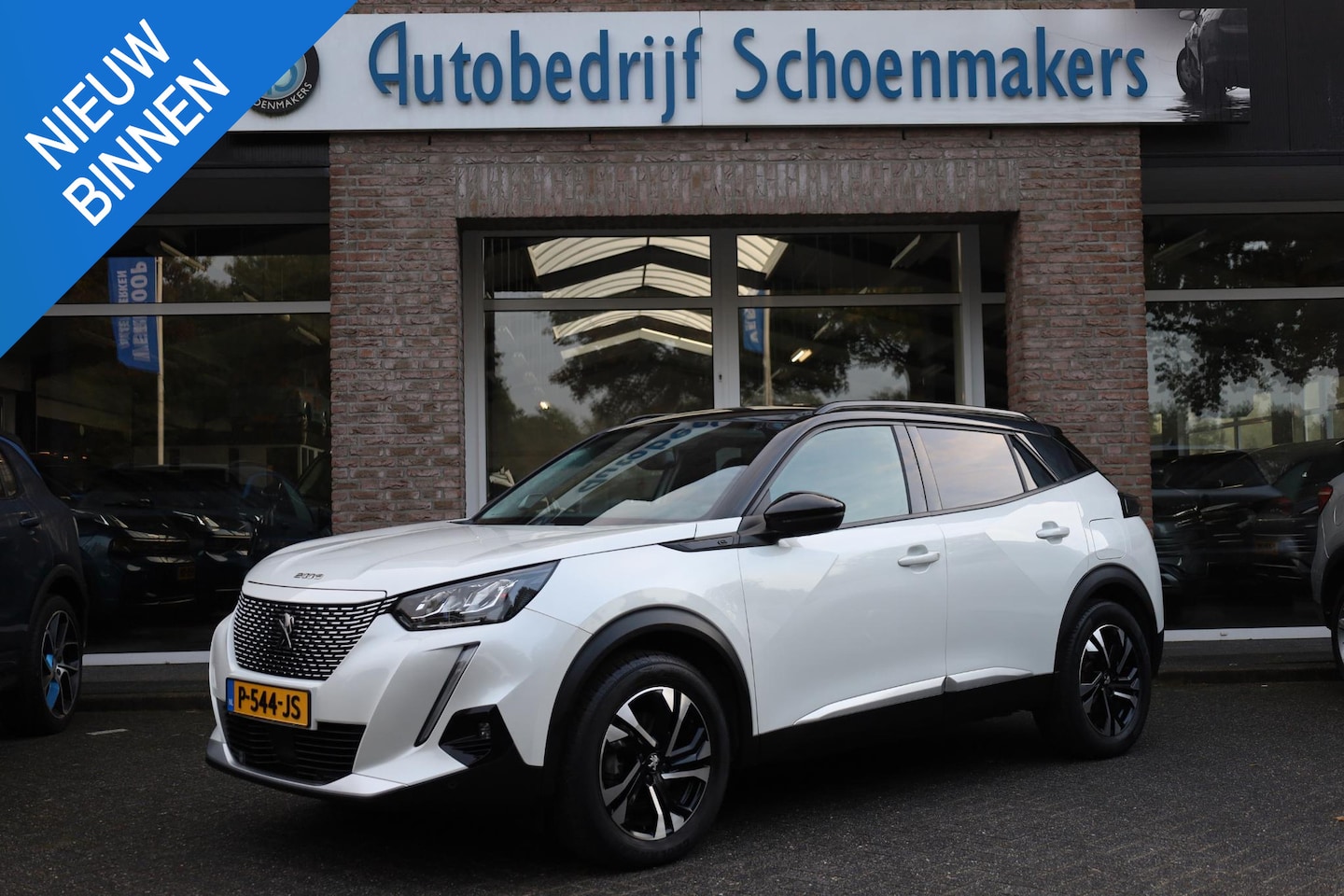 Peugeot e-2008 - EV Allure Première CAMERA CARPLAY DAB CRUISE HALFLEER CLIMA 17"LMV - AutoWereld.nl