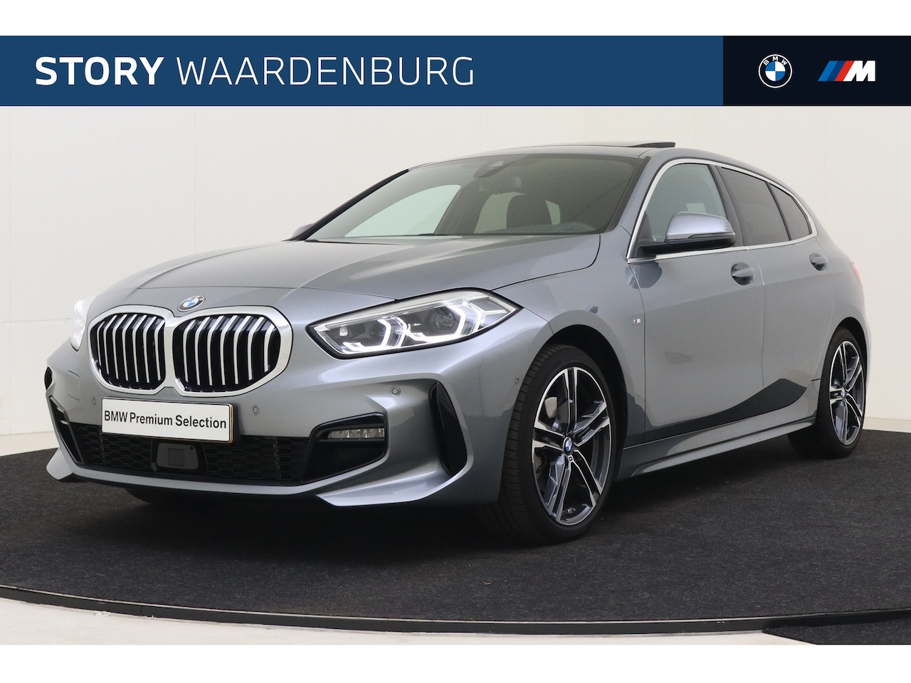 BMW 1-serie - 118i High Executive M Sport Automaat / Panoramadak / Sportstoelen / Active Cruise Control - AutoWereld.nl