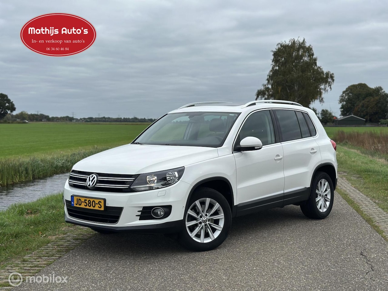 Volkswagen Tiguan - 1.4 TSI Comfort&Design Pano PDC Navi 100% onderhouden! - AutoWereld.nl