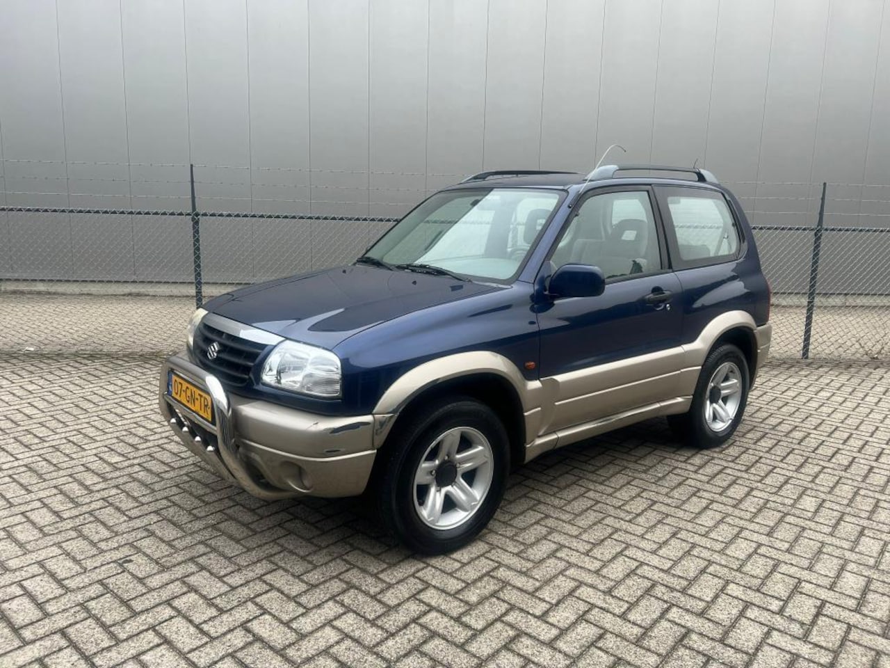 Suzuki Grand Vitara - 2.0 Metal Top Wide Body 4X4 4WD - AutoWereld.nl