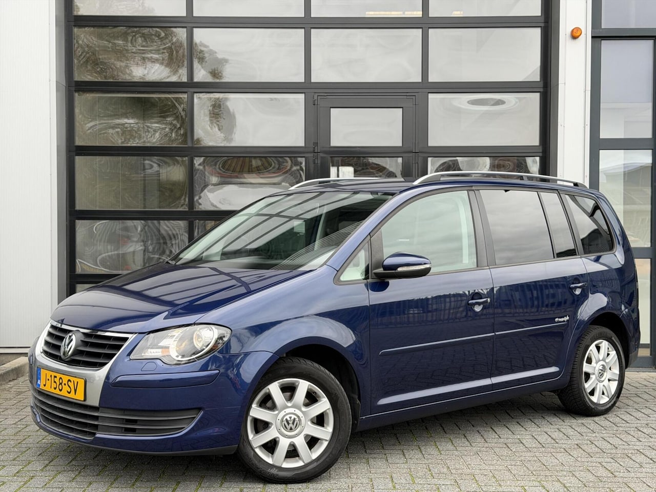 Volkswagen Touran - 1.6 16V FSI Freestyle / Cruise / Navi / AC - AutoWereld.nl