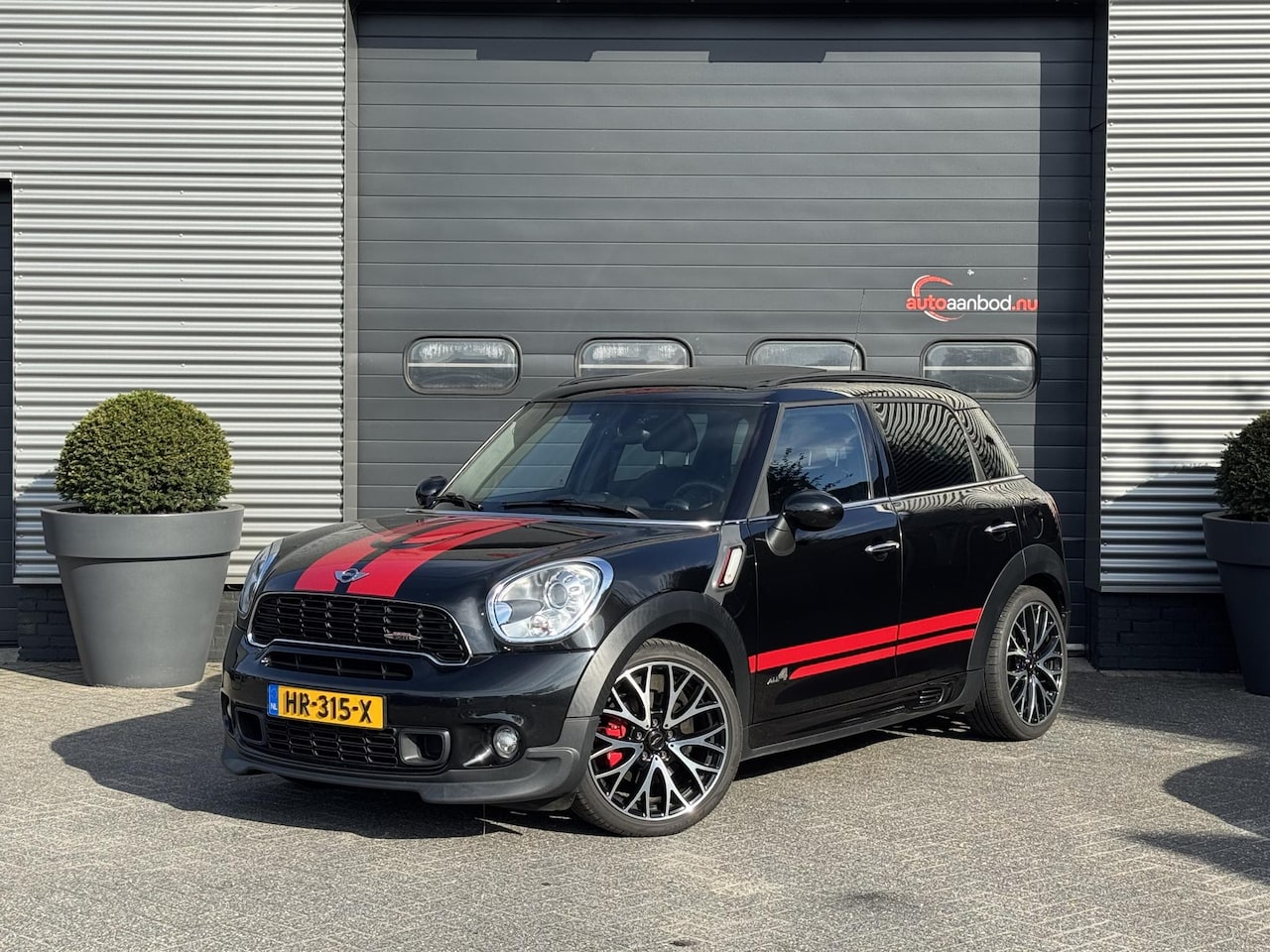 MINI Countryman - Mini 1.6 John Cooper Works ALL4 Chili | Panoramadak | Navigatie | 19 Inch Lichtmetalen Vel - AutoWereld.nl