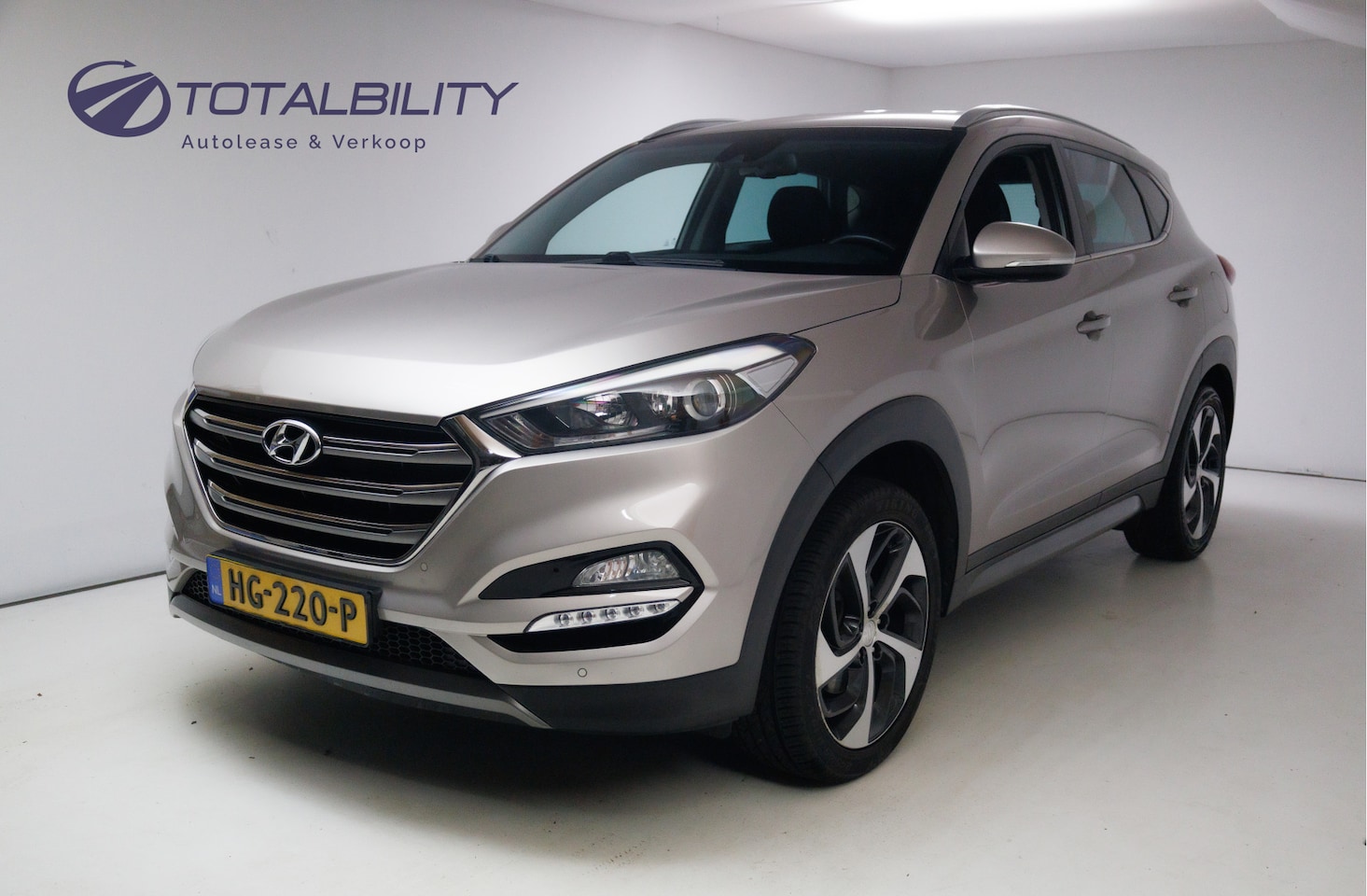 Hyundai Tucson - 1.6 GDi Comfort 132 PK | 19" | Camera | Stoel- & Achterbankverwarming | Trekhaak | Navigat - AutoWereld.nl