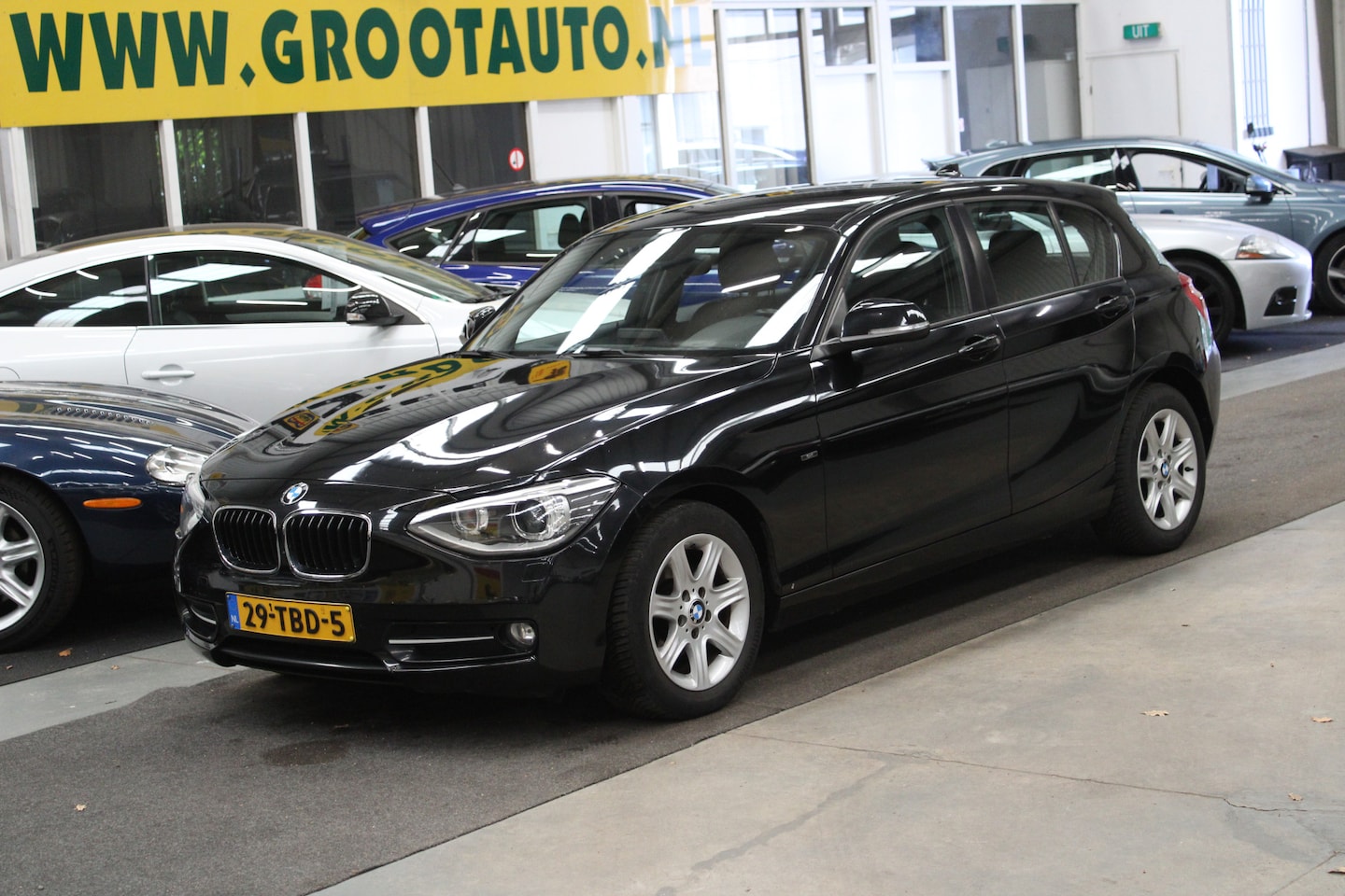 BMW 1-serie - 116i Business Airco, Cruise Control, Navigatie, Stuurbekrachtiging - AutoWereld.nl