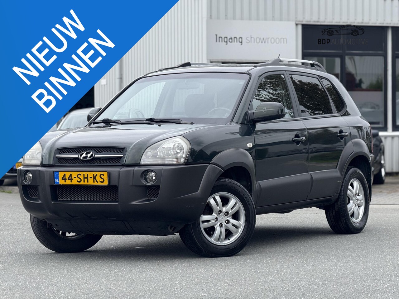 Hyundai Tucson - 2.0i Dynamic AIRCO/CRUISE/TREKHAAK - AutoWereld.nl
