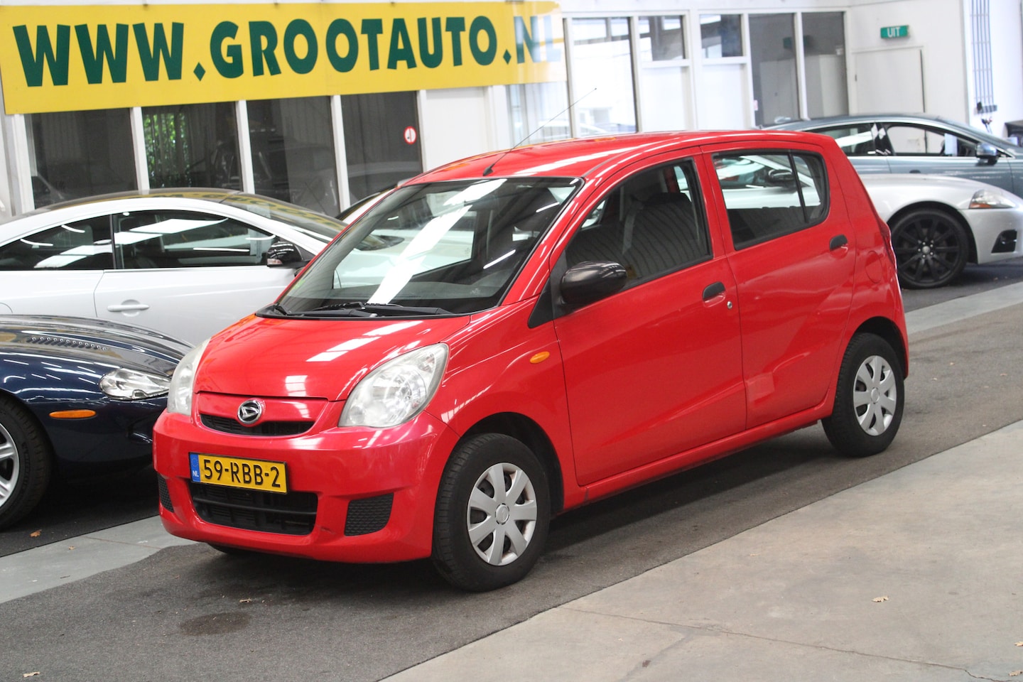 Daihatsu Cuore - 1.0 Clever Airco, Stuurbekrachtiging - AutoWereld.nl