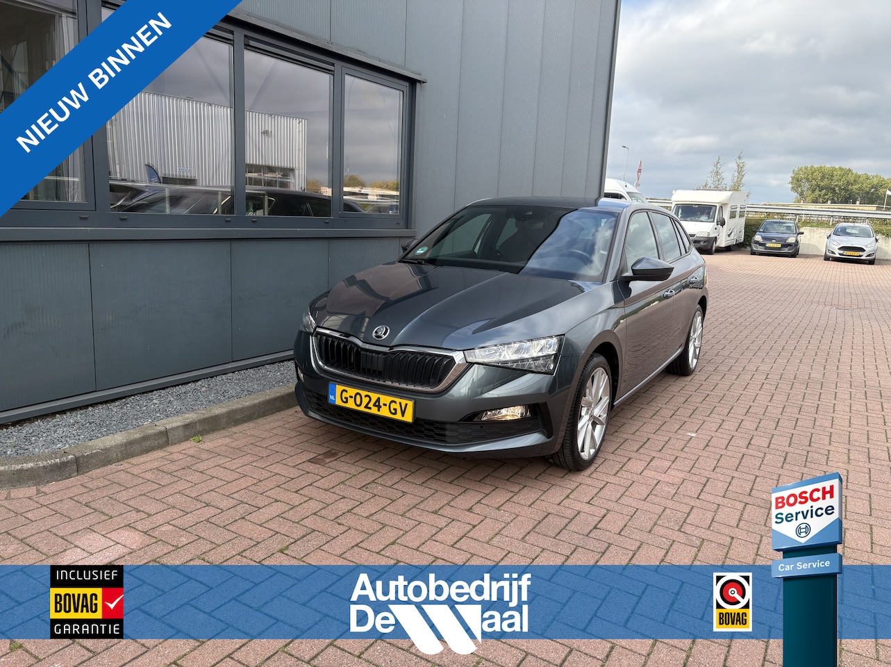 Skoda Scala - 1.0 TSi Sport Business CLIMA/CRUISE/CARPLAY/DAB/PDC/18INCH/TREKHAAK - AutoWereld.nl