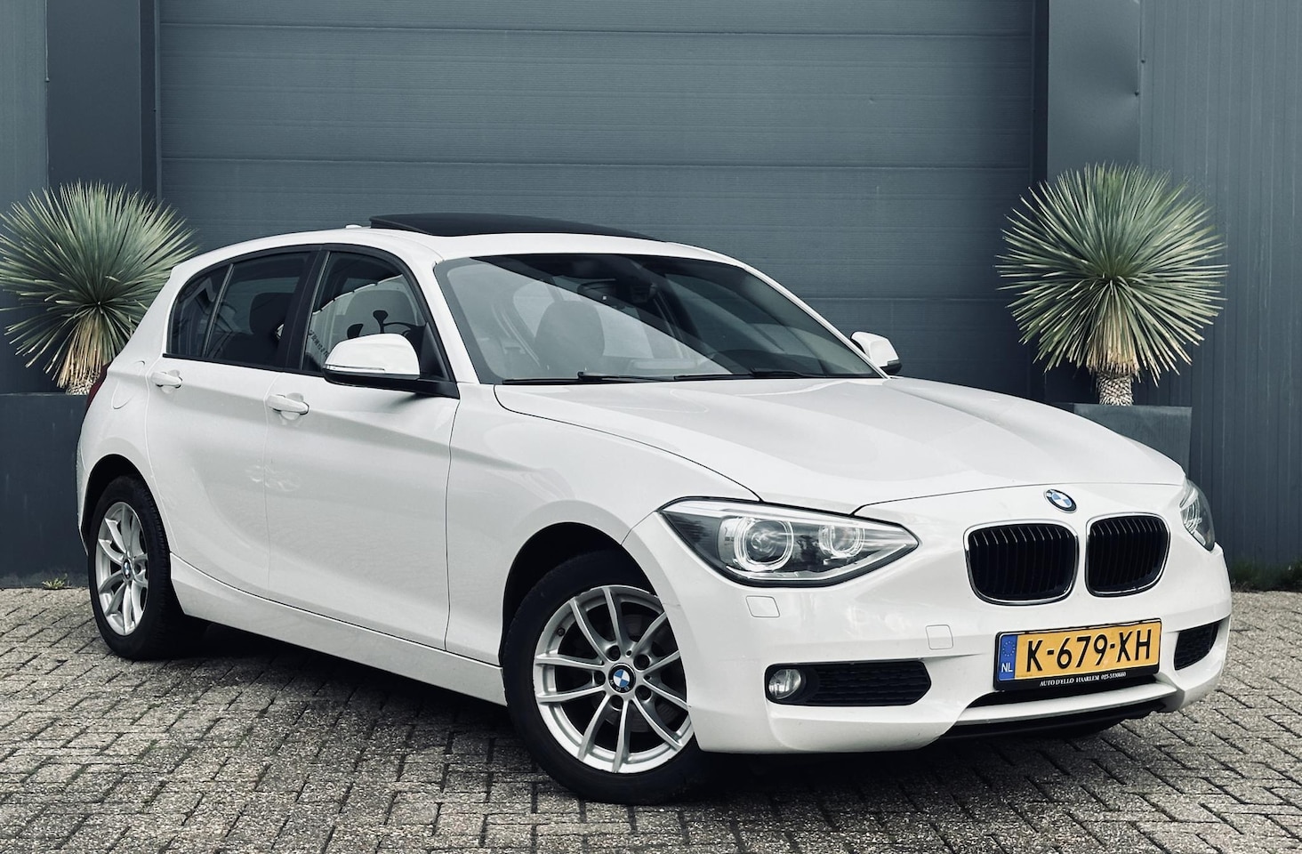 BMW 1-serie - 116i Schuifdak/Navi/PDC - AutoWereld.nl