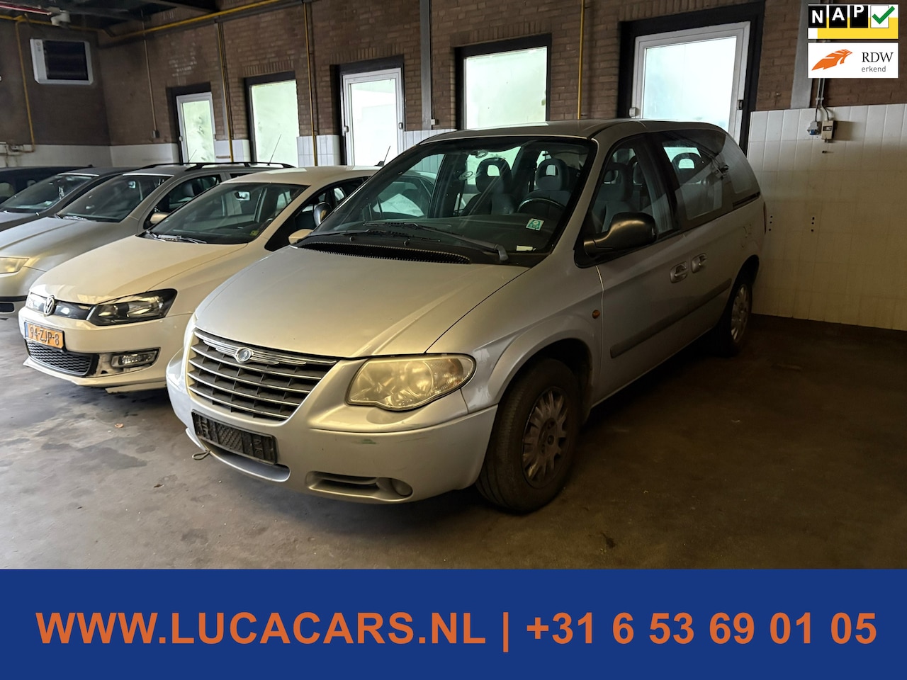 Chrysler Voyager - 2.4i SE Luxe 7p - AutoWereld.nl