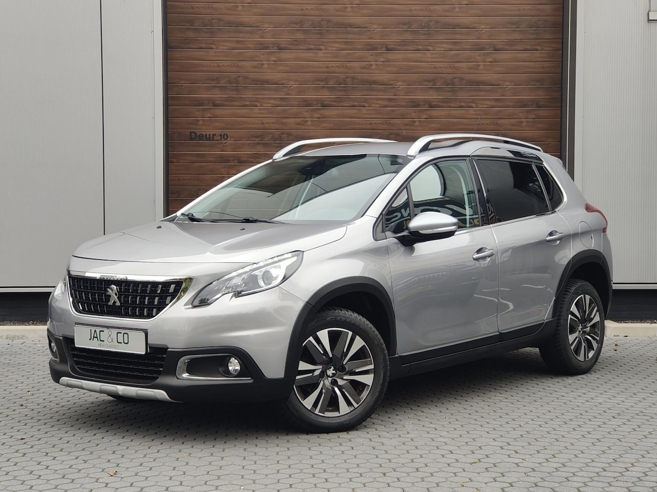 Peugeot 2008 - 1.2 PureTech Allure NAVI - AUTOMAAT - AutoWereld.nl