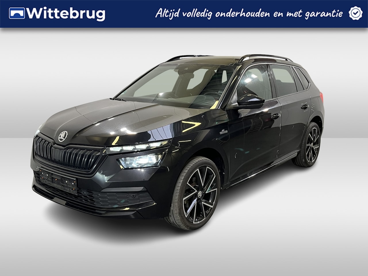 Skoda Kamiq - 1.5 TSI Monte Carlo / AUTOMAAT/ ELEKTR. TREKHAAK/ PANO/ DIGITAL DASH/ CRUISE/ LED/ PARK. S - AutoWereld.nl