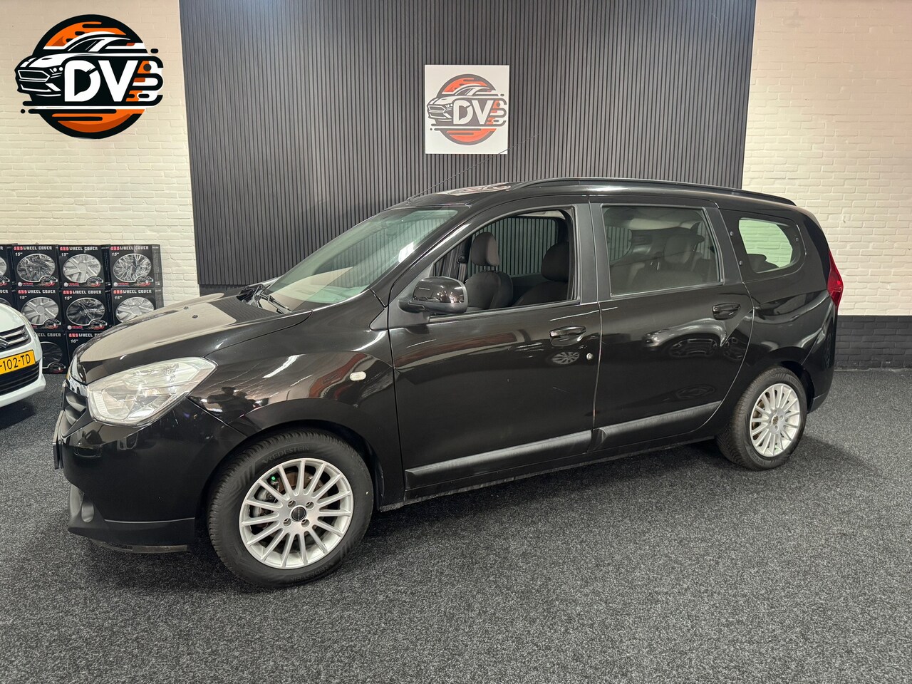 Dacia Lodgy - 1.2 TCe Prestige 7p. NAV, CRUISE, 7 ZITS, TREKHAAK, PDC - AutoWereld.nl