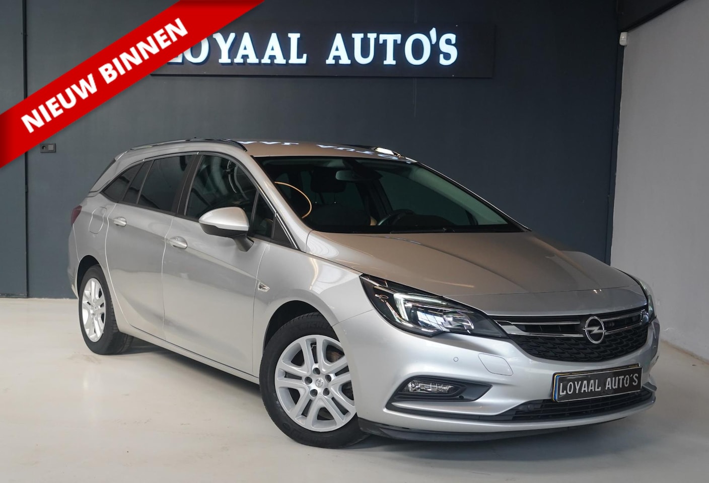 Opel Astra Sports Tourer - 1.0 Turbo 120 Jaar Edition | NAVI | CRUISE | AIRCO | PDC | APK - AutoWereld.nl