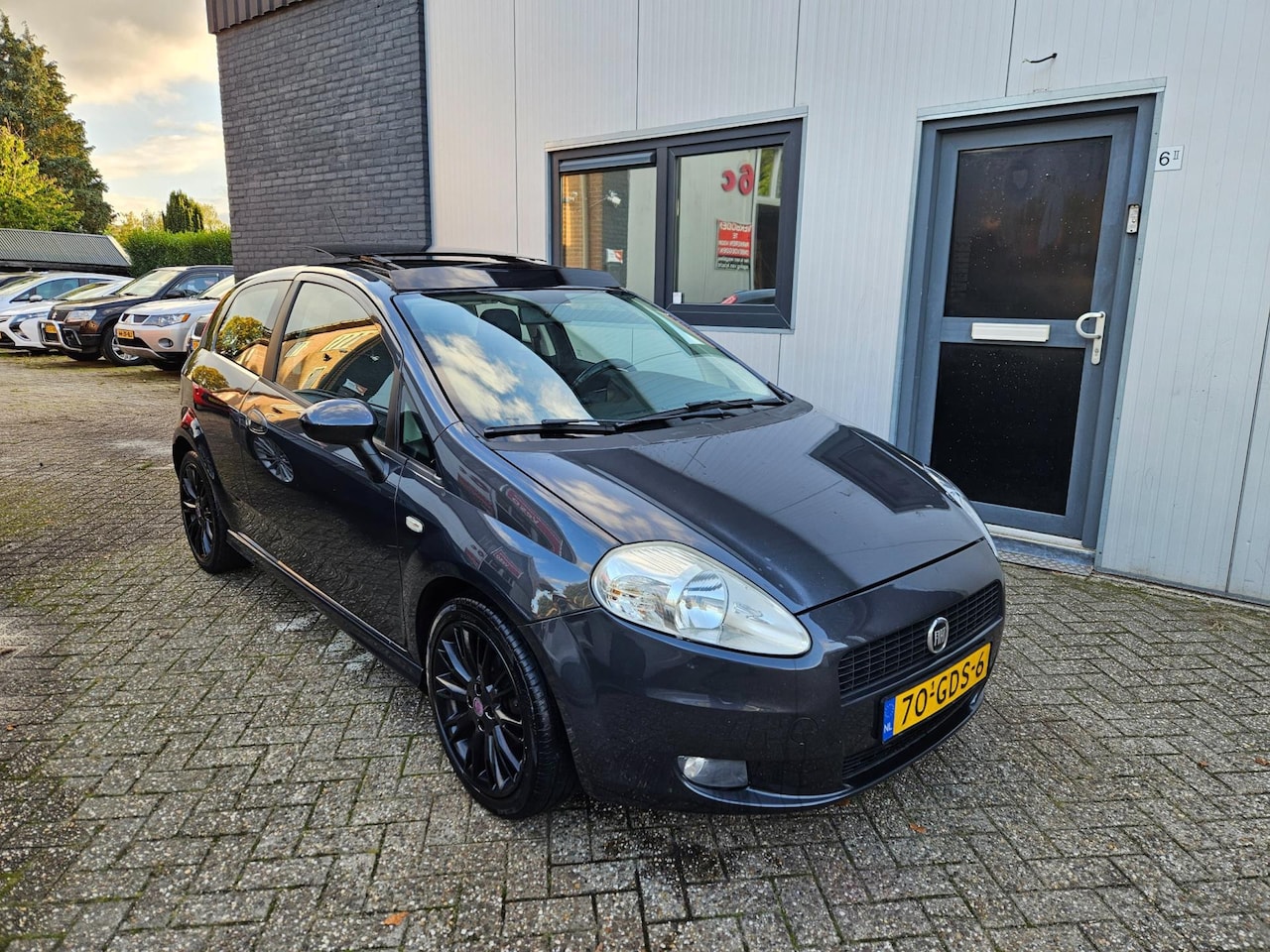 Fiat Grande Punto - 1.4 GP Airco / Cruise / Panoramadak - AutoWereld.nl