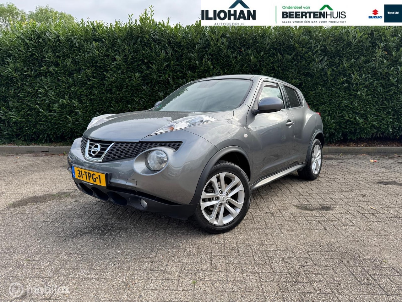 Nissan Juke - 1.6 Acenta ECO Navi Camera Trekhaak Clima - AutoWereld.nl
