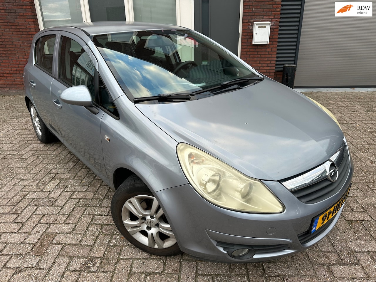 Opel Corsa - 1.2-16V Enjoy / 5DRS / Cruise / Airco / NAP / LM - AutoWereld.nl
