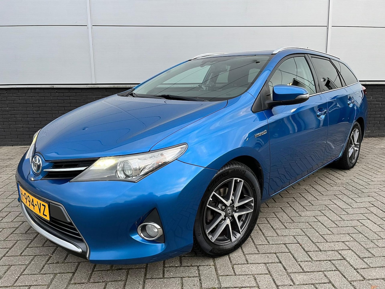 Toyota Auris Touring Sports - 1.8 Hybrid DAB - clima - camera - cruise control - privacy glass - isofix - AutoWereld.nl