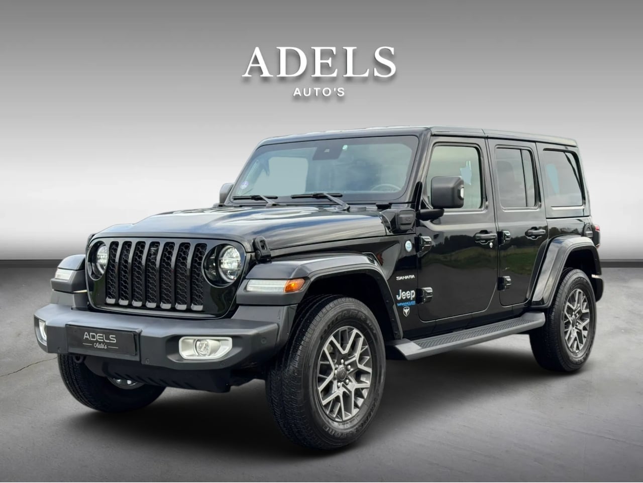 Jeep Wrangler Unlimited - 4xe 380 Sahara BLACK Trekhaak TreePlanken - AutoWereld.nl
