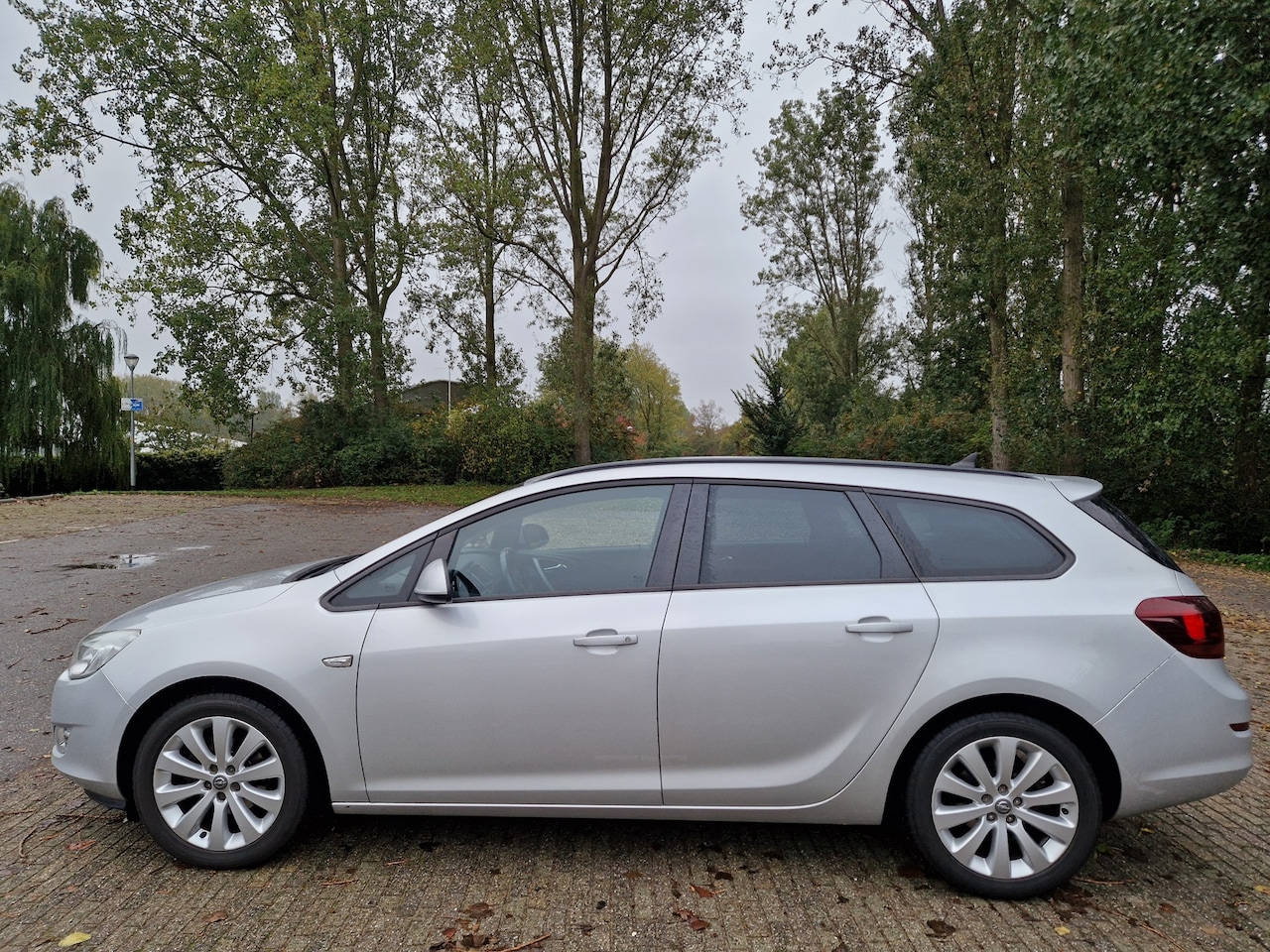 Opel Astra Sports Tourer - 1.4 Turbo Cosmo Opel Astra-J 1.4. Turbo 88kw SP.T. Cosmo - AutoWereld.nl