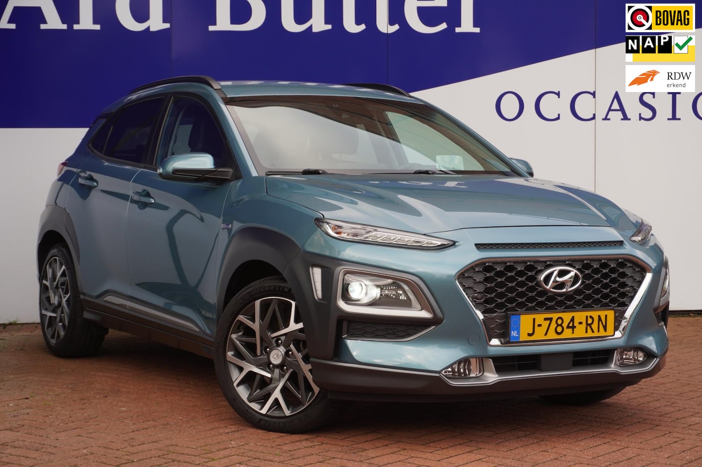 Hyundai Kona - 1.6 GDI HEV Premium +Volleder+Breed-Navigatie+camera+stoel&stuur-verw18"Lmv =SUPER !! - AutoWereld.nl