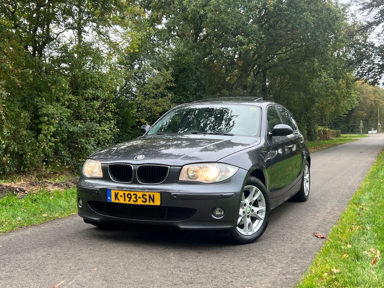 BMW 1-serie - 120i High Executive | Schuifdak + Cruise + Leder | - AutoWereld.nl