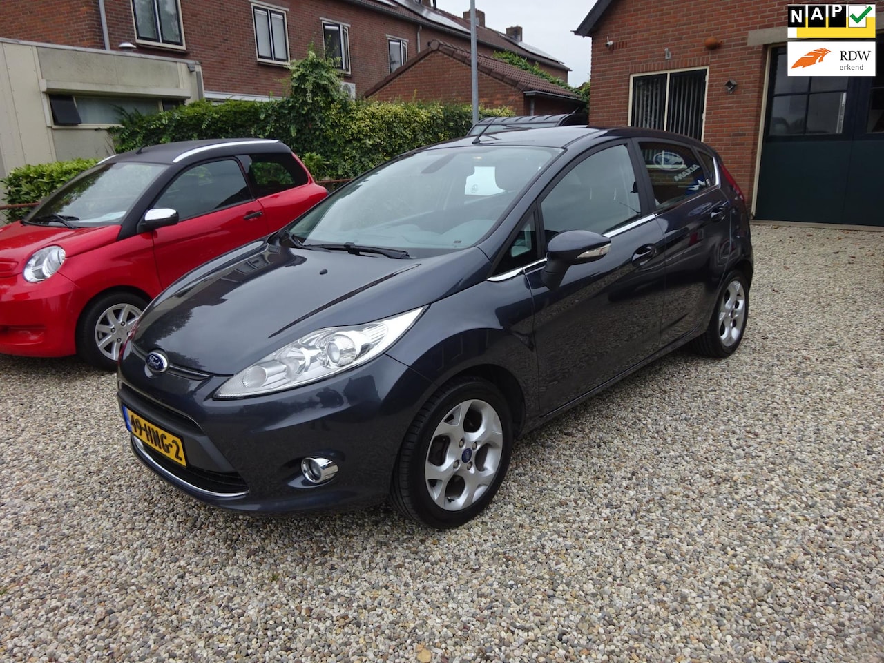 Ford Fiesta - 1.25 Ghia Climate controle, Cruise controle, Parkeersensoren, Trekhaak, Lichtmetalen velge - AutoWereld.nl