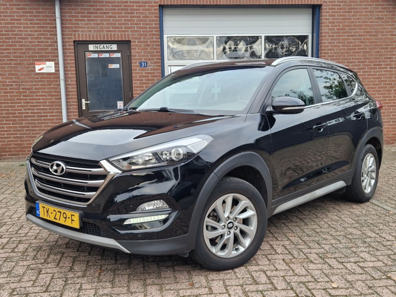 Hyundai Tucson - 1.6 GDI Comfort NL-auto Navi Clima Cruise Camera Trekhaak - AutoWereld.nl