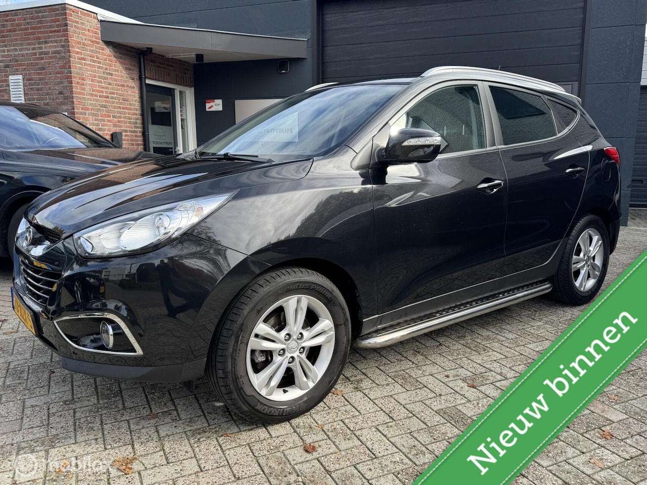 Hyundai ix35 - 2.0i Business Edition AUTOMAAT / NAVI / CAMERA / TREKHAAK - AutoWereld.nl